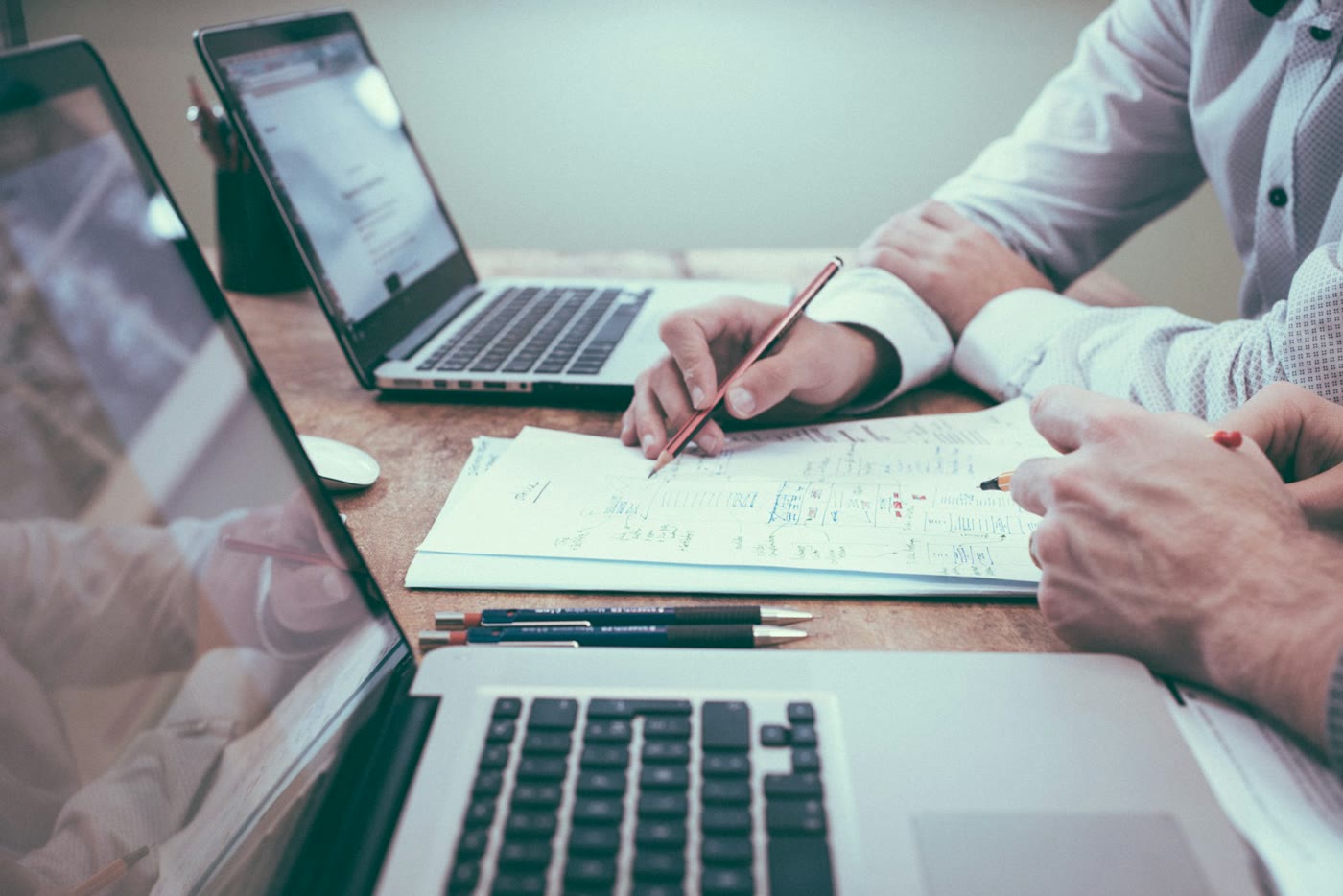 Insurance advisors reviewing coverage details together at a desk