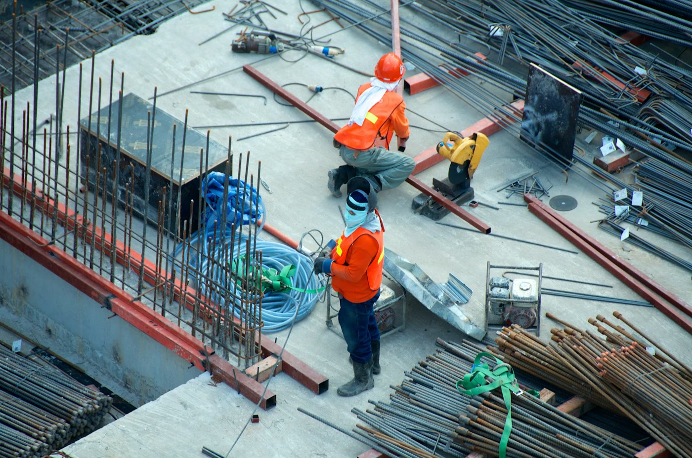 Construction workers with safety gear on an active jobsite